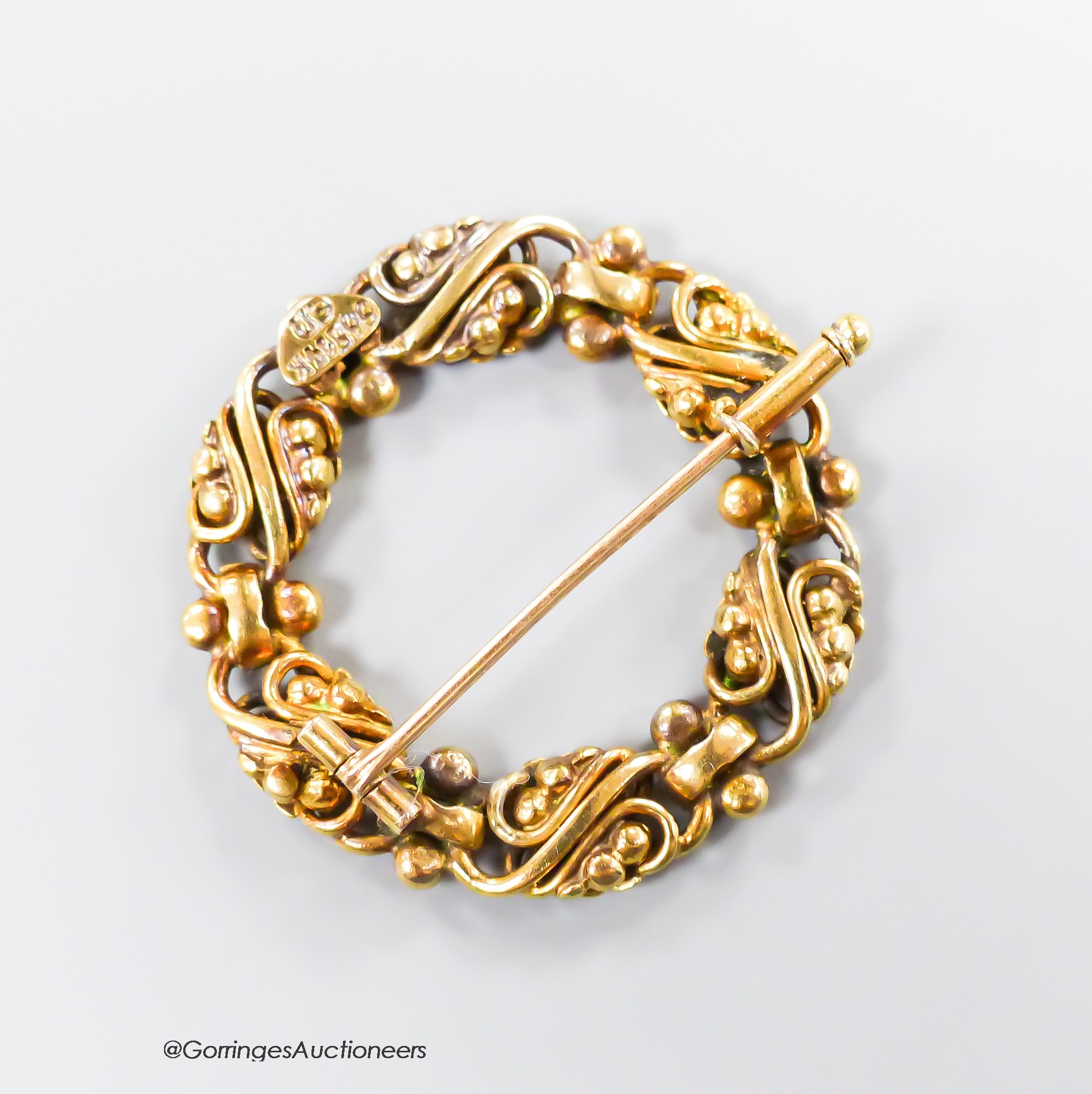 A continental pierced 14k open work circular brooch, maker's mark EN, 31mm, 8.3 grams.